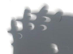 Solar Eclipse Stage 8 - Through fingers